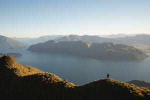 Person enjoying life, pain free, hiking in the mountains in the morning.